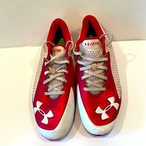 Under Armour red and white men baseball cleats, size 7